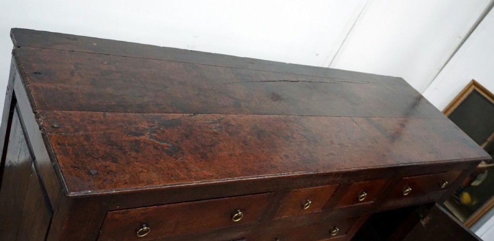An amazing early 18th century oak dresser baser  View III