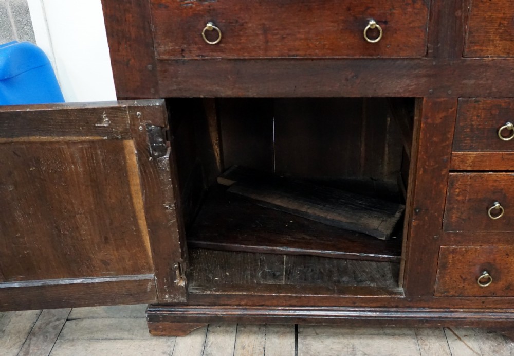 An amazing early 18th century oak dresser baser  View IV