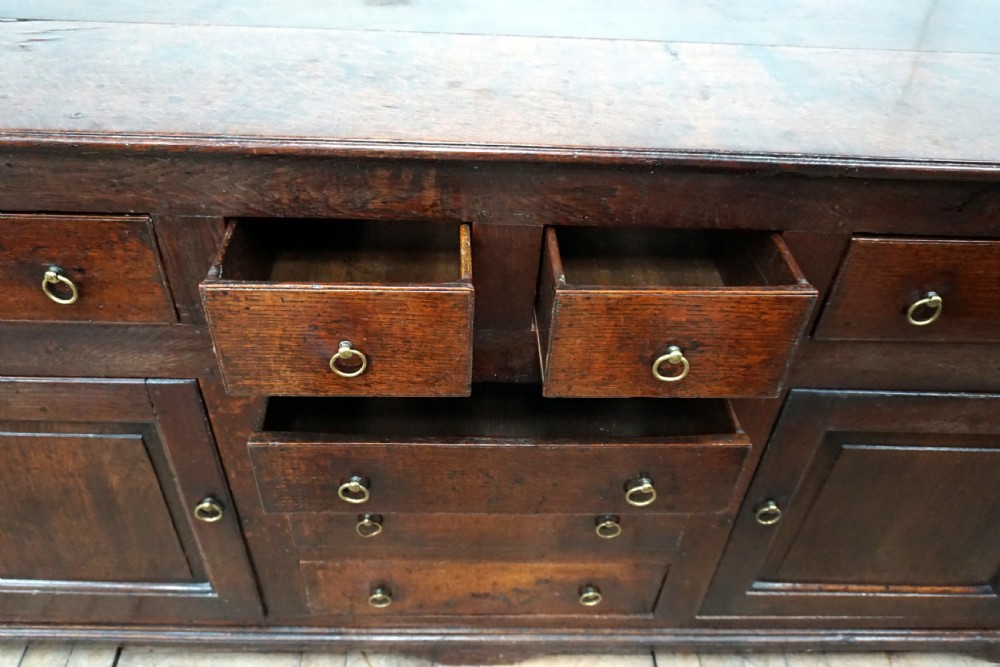 An amazing early 18th century oak dresser baser  View VI