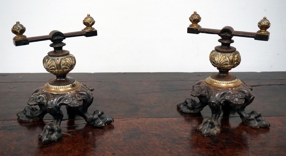 A superb pair of early Victorian bronze and cast iron andirons 