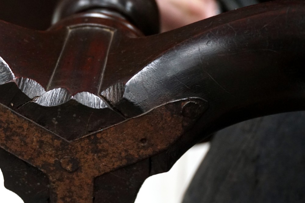A Georgian mahogany tilt-top table featuring a circular top over a turned central stem and tripod cabriole legs with pad feet. View III