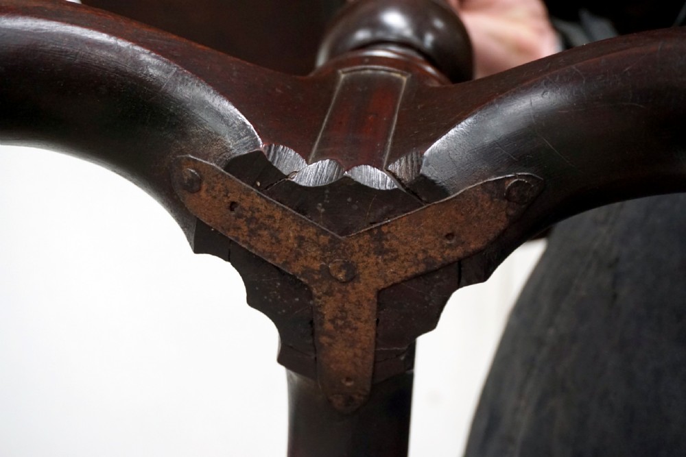 A Georgian mahogany tilt-top table featuring a circular top over a turned central stem and tripod cabriole legs with pad feet. View VI