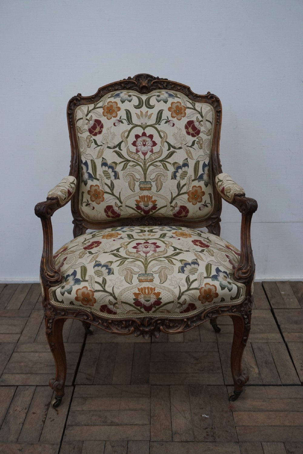 An exceptionally well carved English open armchair 