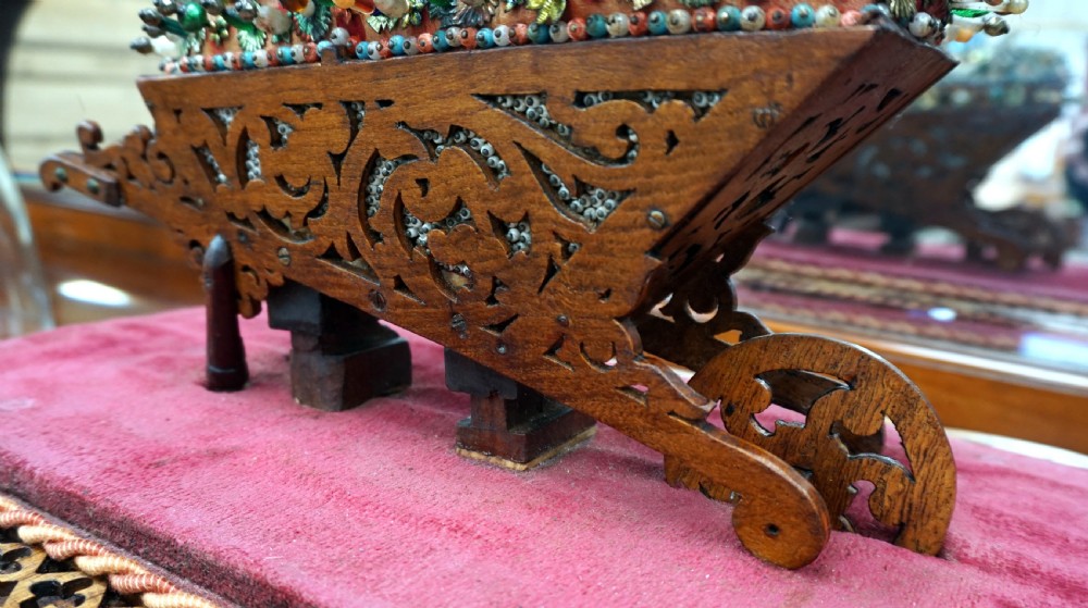 A rare and unusual beedwork wheelbarrow under dome  View V