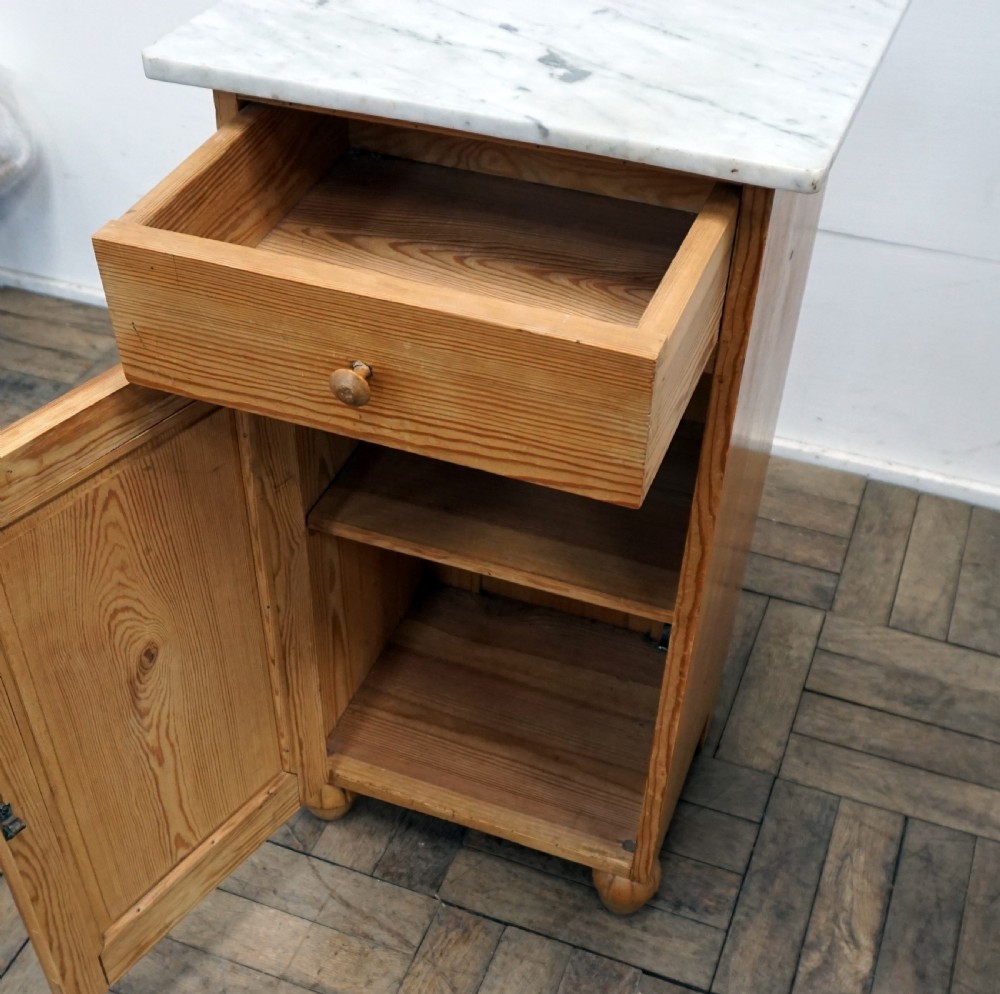 A pair of continental marble top pine bedside cabinets View VI