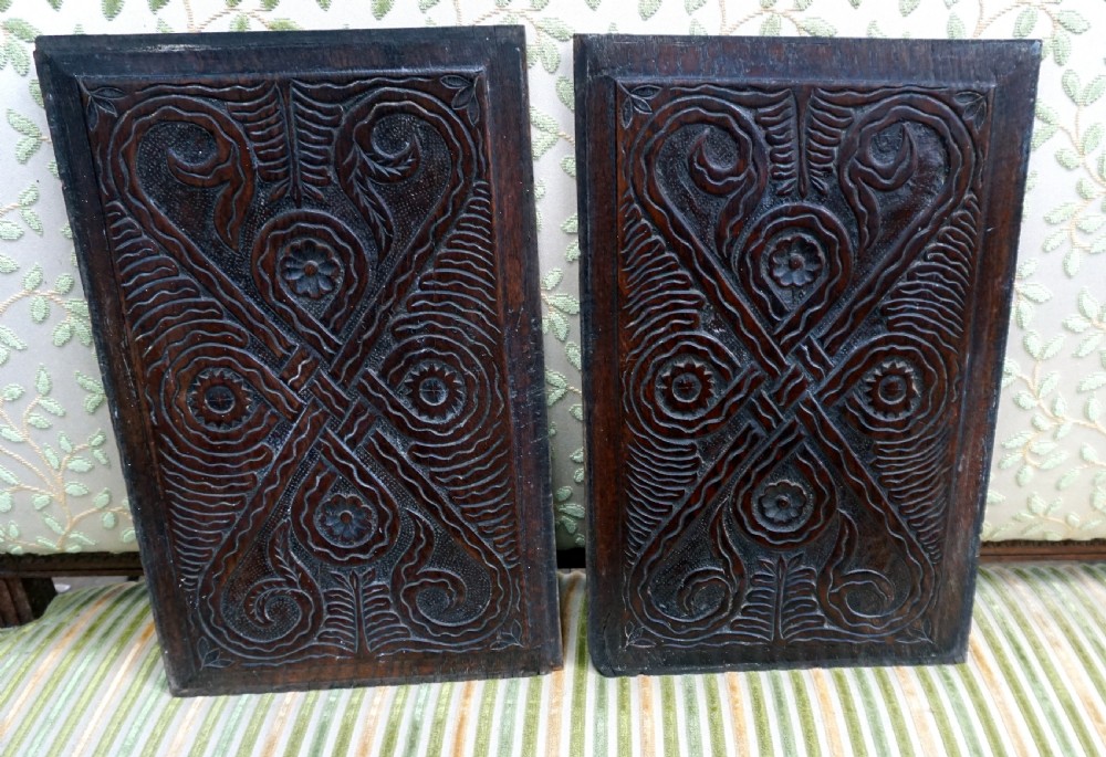 A pair of carved oak English panels 