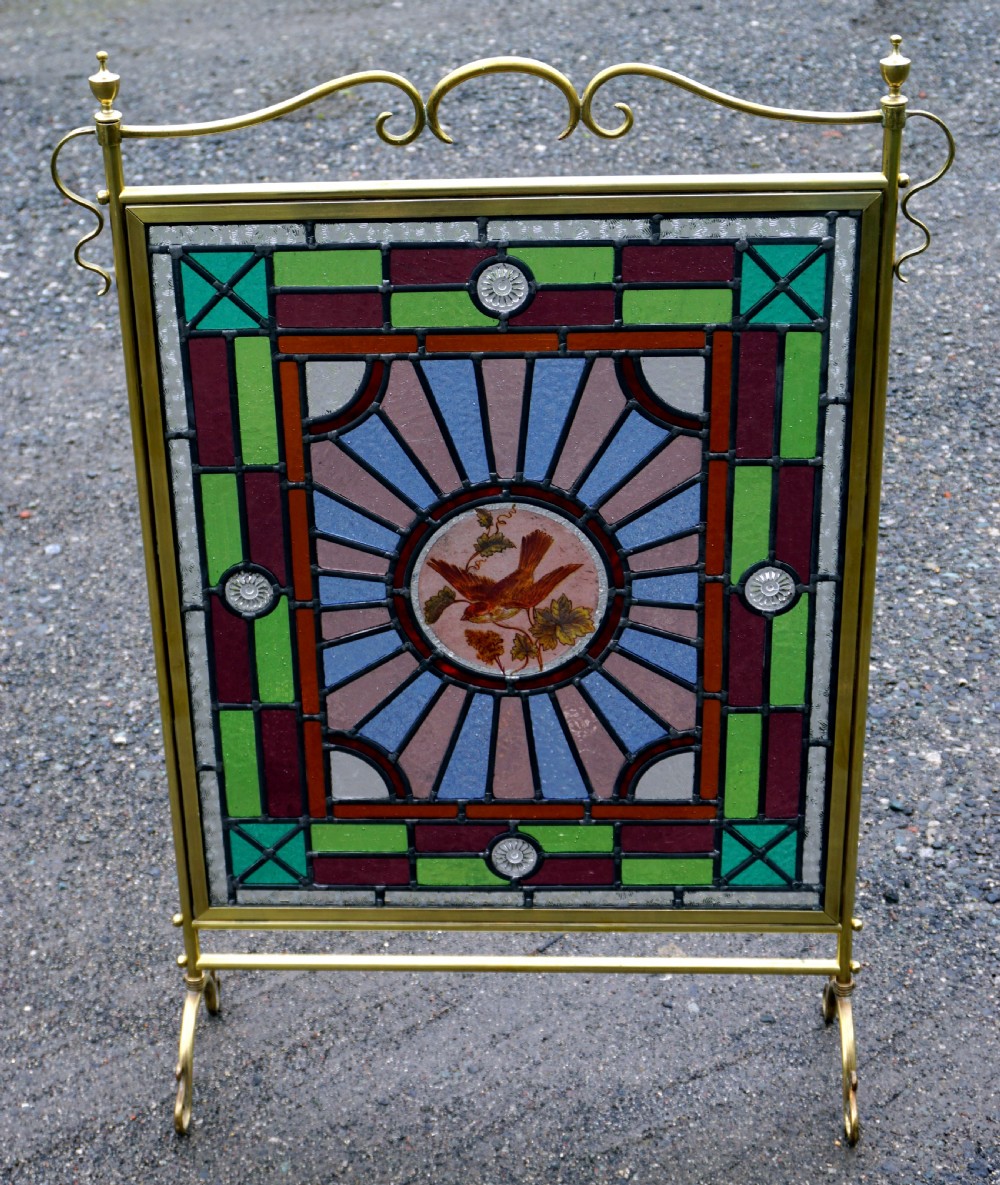A good late Victorian leaded glass and brass fire screen
