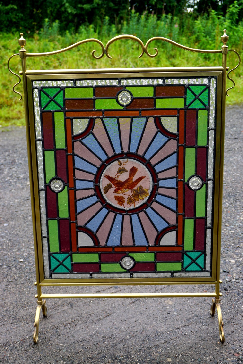 A good late Victorian leaded glass and brass fire screen View II