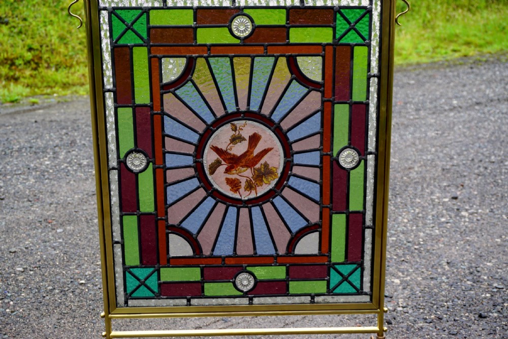A good late Victorian leaded glass and brass fire screen View IV