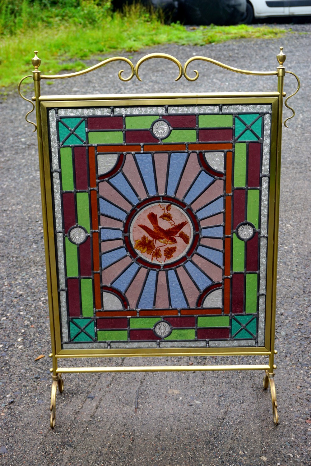 A good late Victorian leaded glass and brass fire screen View VI
