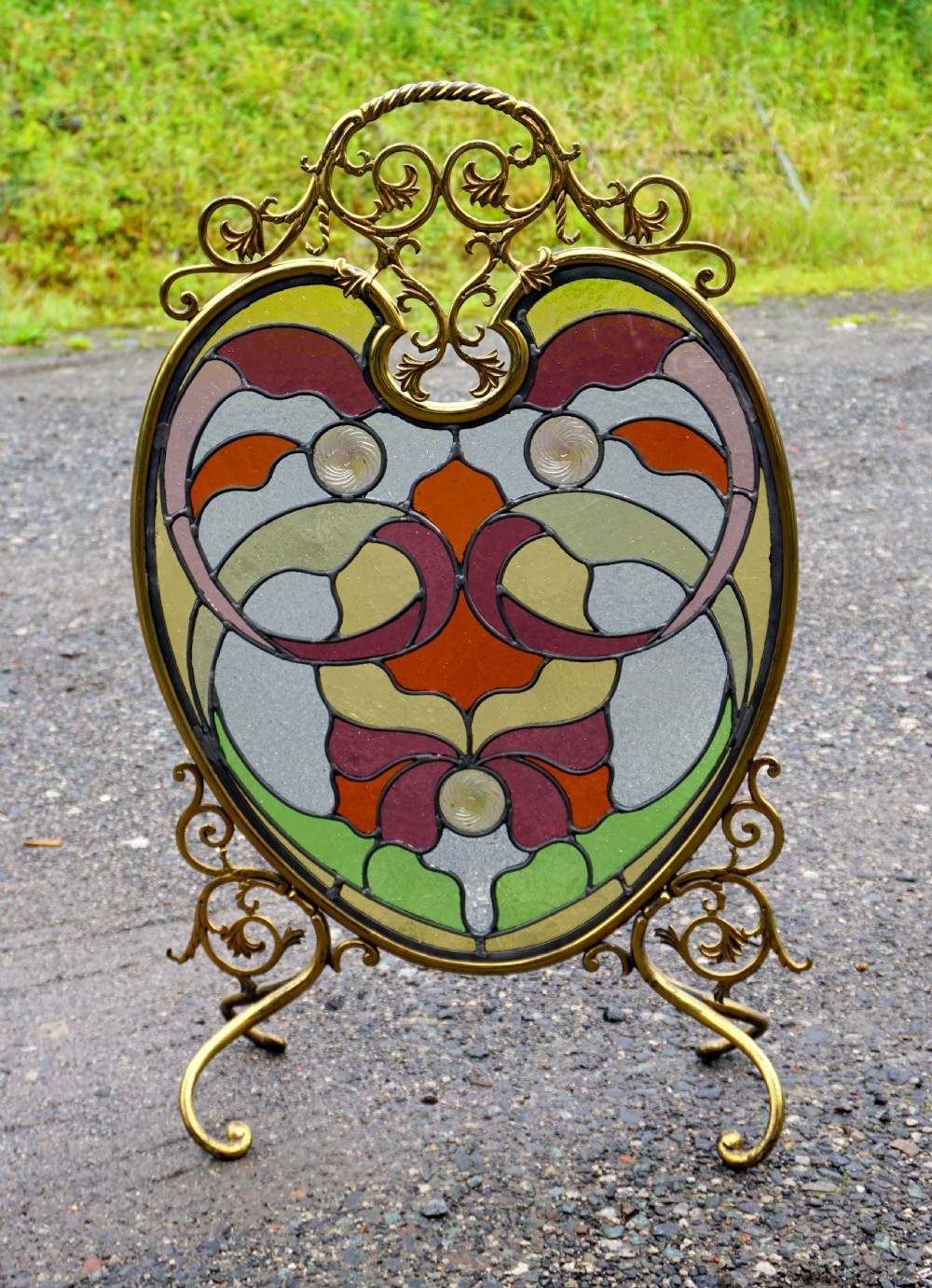 A stunning art nouveau brass and leaded glass fire screen View II