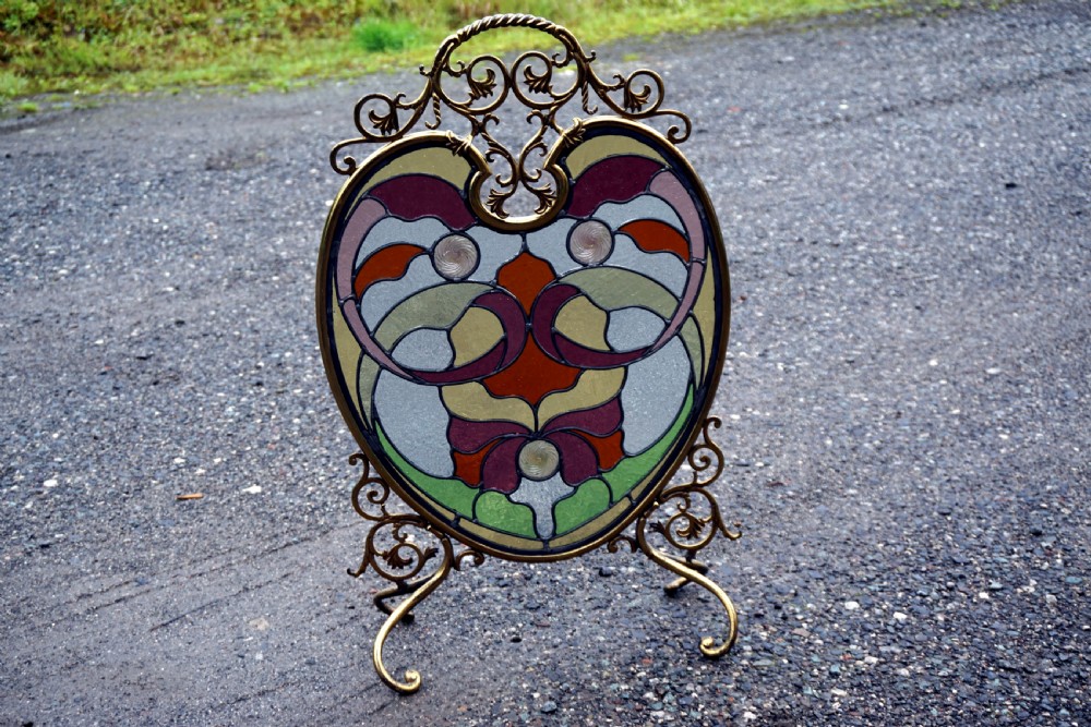 A stunning art nouveau brass and leaded glass fire screen View III