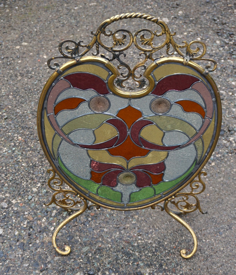 A stunning art nouveau brass and leaded glass fire screen View IV