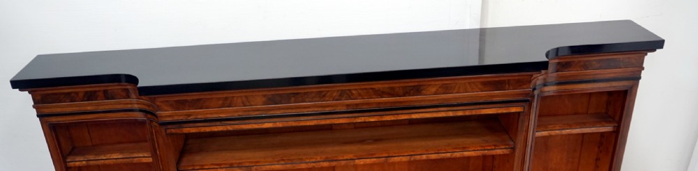 A magnificent narrow Victorian walnut and ebonised open shelf bookcase View III