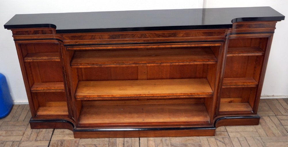 A magnificent narrow Victorian walnut and ebonised open shelf bookcase View V