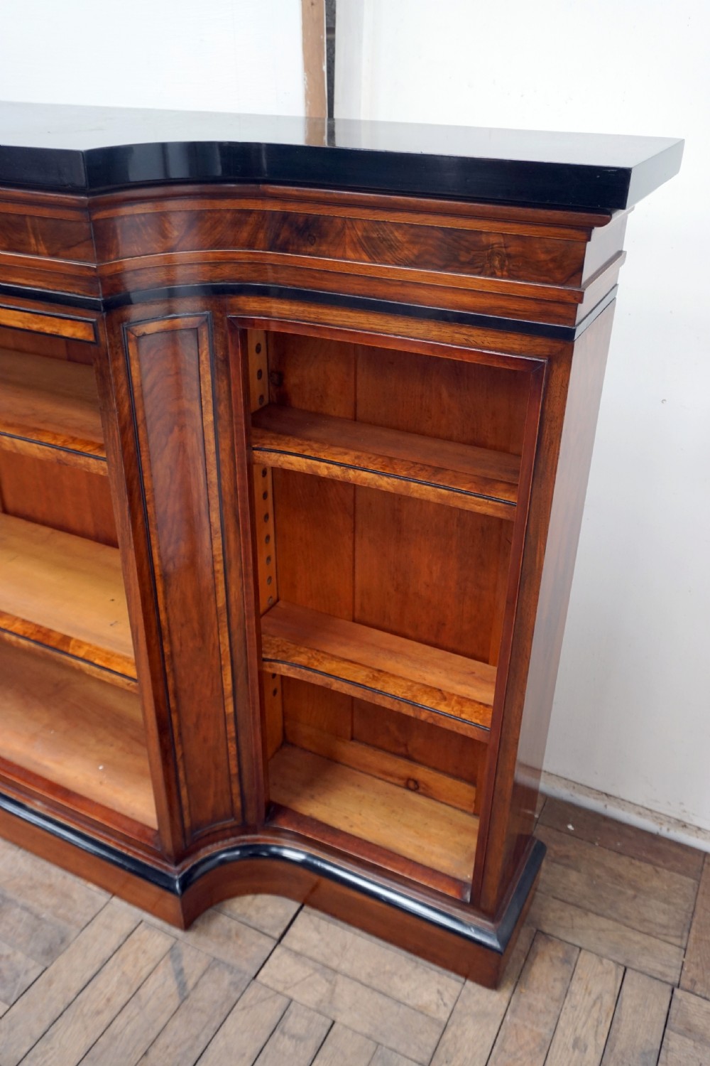 A magnificent narrow Victorian walnut and ebonised open shelf bookcase View VIII