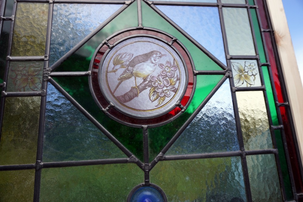 A stunning painted leaded glass bird window View III