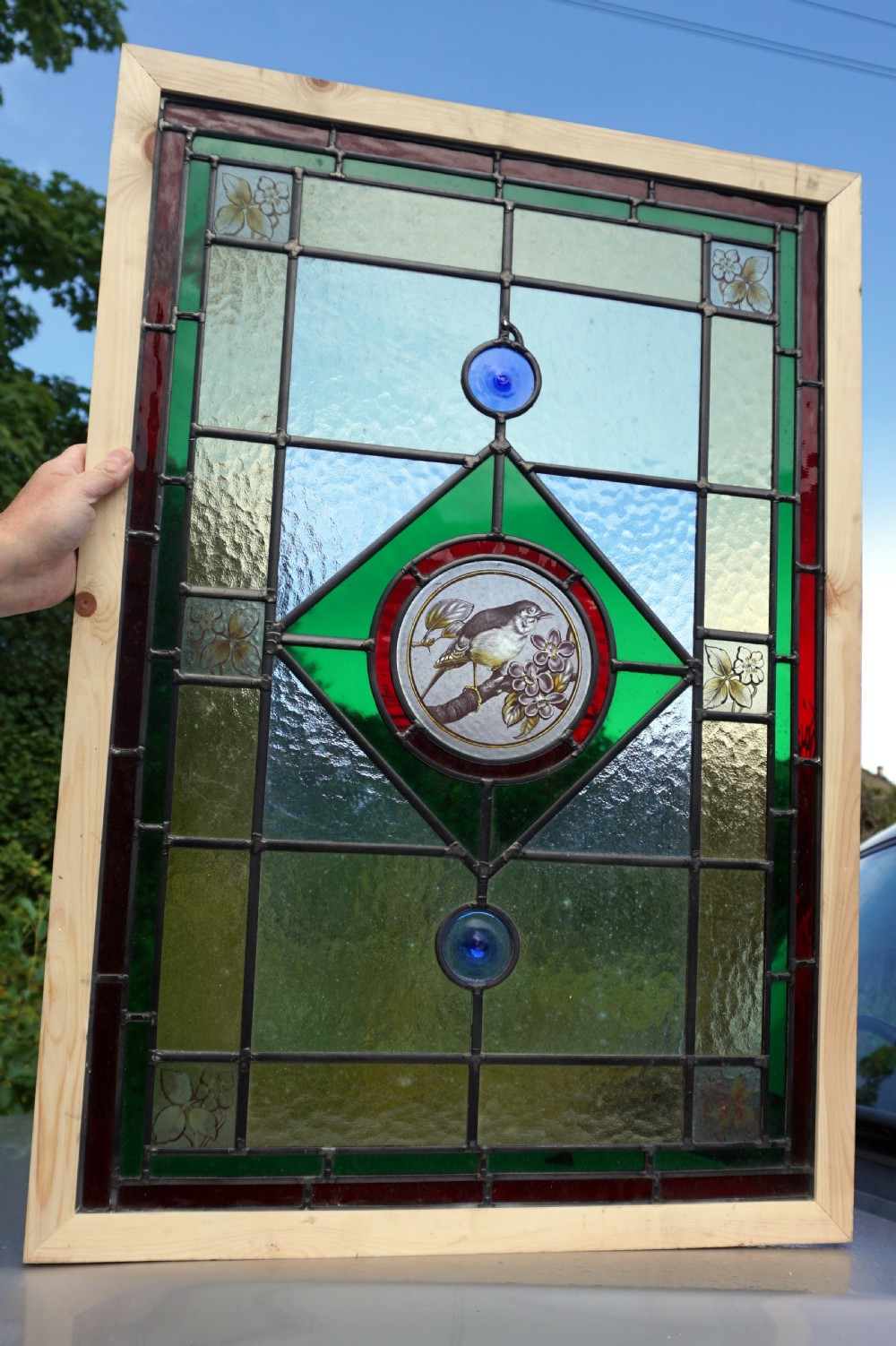 A stunning painted leaded glass bird window View V