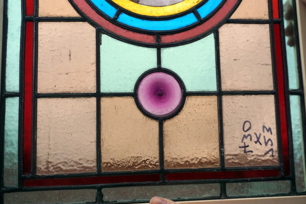A good stained glass window with painted bird to the centre View III