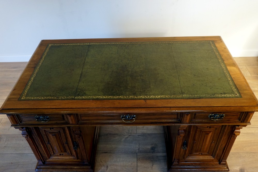 An outstanding walnut English Victorian pedastal desk by Howard and Son View V