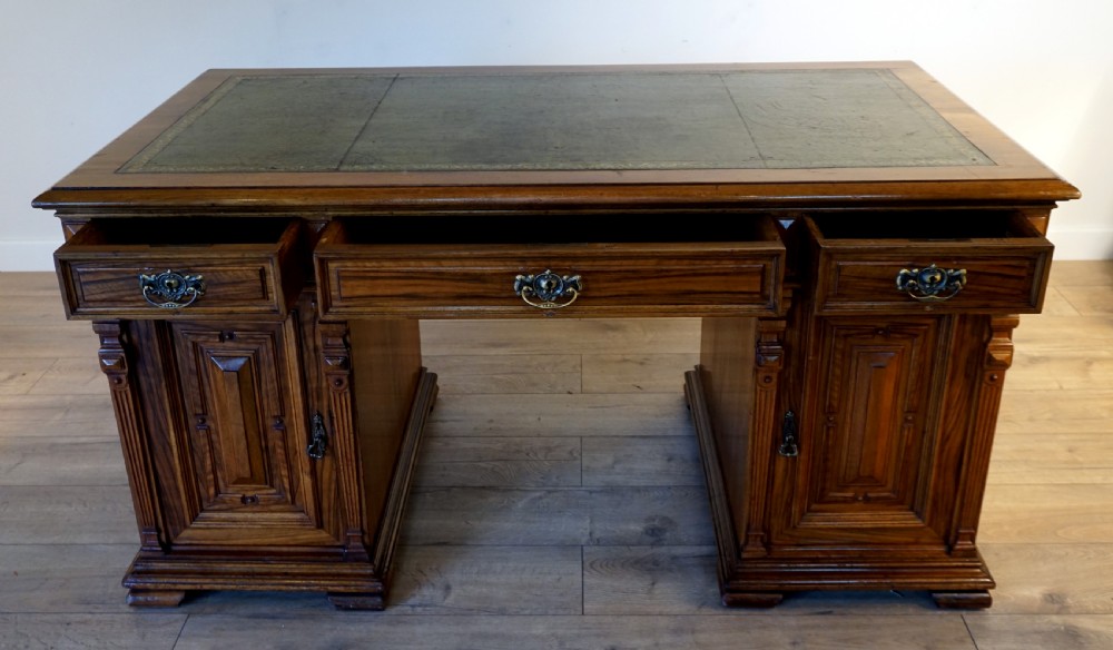 An outstanding walnut English Victorian pedastal desk by Howard and Son View VI