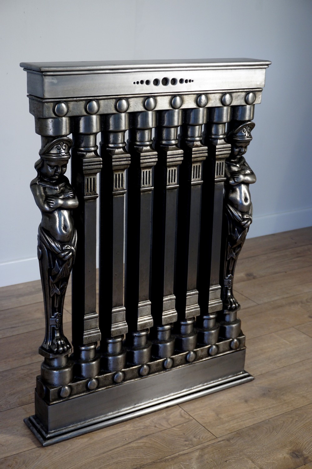 An exceptionally rare set of 3 cast iron early 20th century figural Ventilo radiators View II