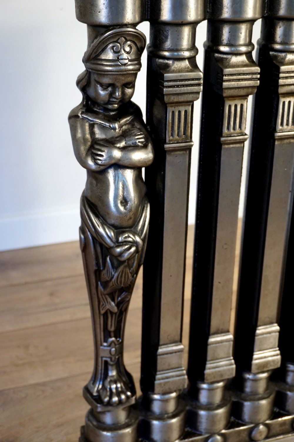 An exceptionally rare set of 3 cast iron early 20th century figural Ventilo radiators View III