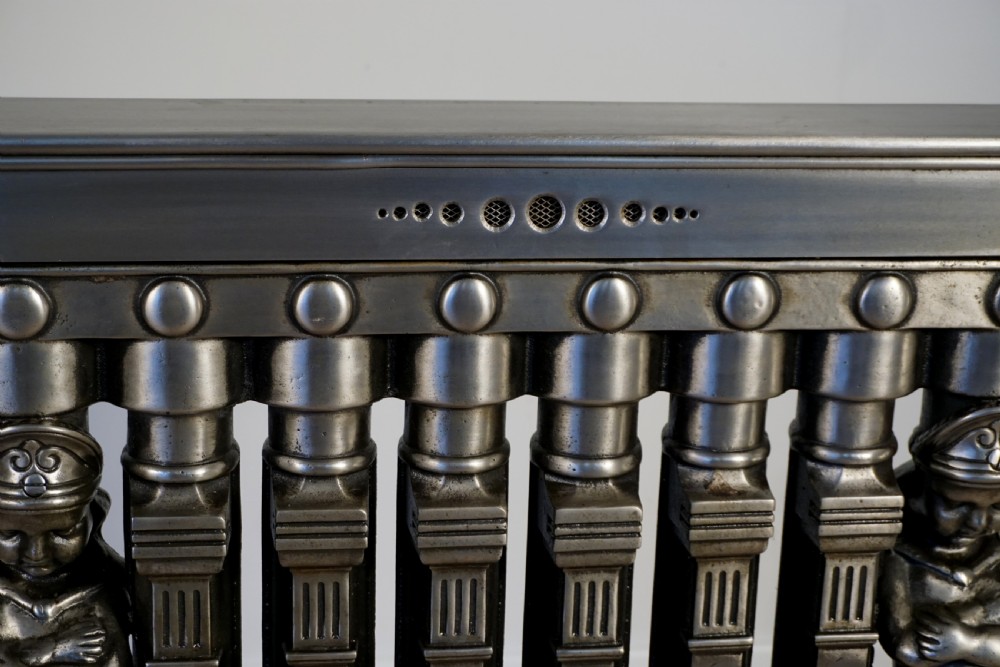 An exceptionally rare set of 3 cast iron early 20th century figural Ventilo radiators View IV