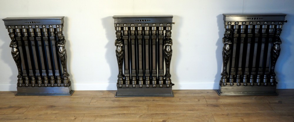 An exceptionally rare set of 3 cast iron early 20th century figural Ventilo radiators View IX