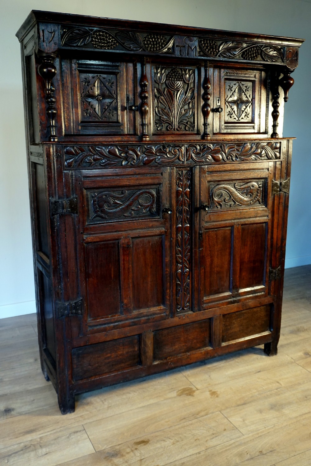 A charming original narrow oak carved court cupboard  View IV