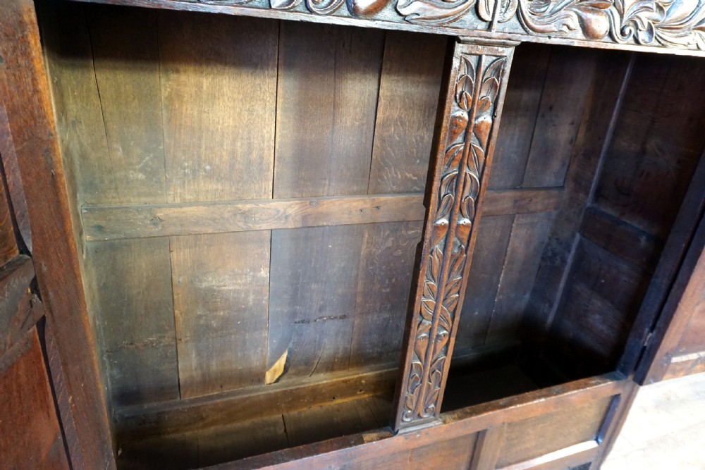 A charming original narrow oak carved court cupboard  View X