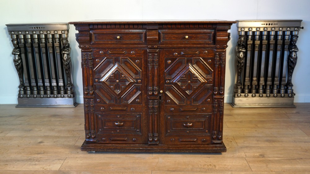 An exceptional Jaobean enclosed oak chest of drawers