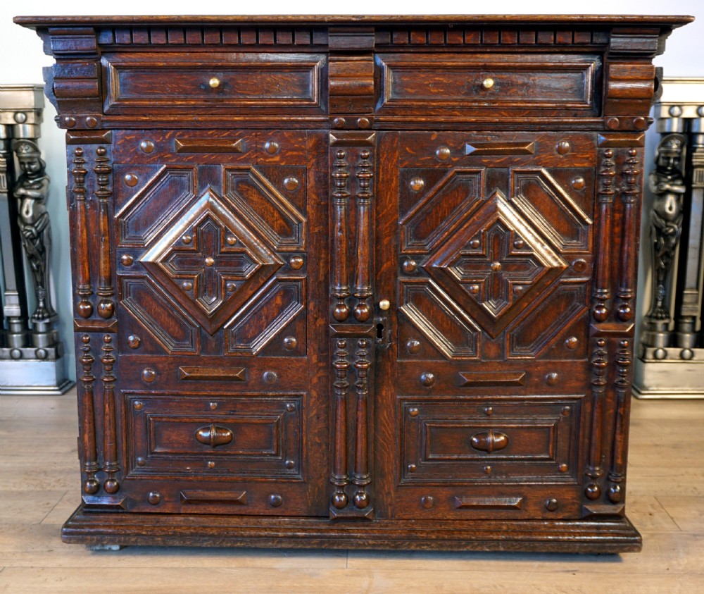 An exceptional Jaobean enclosed oak chest of drawers View II