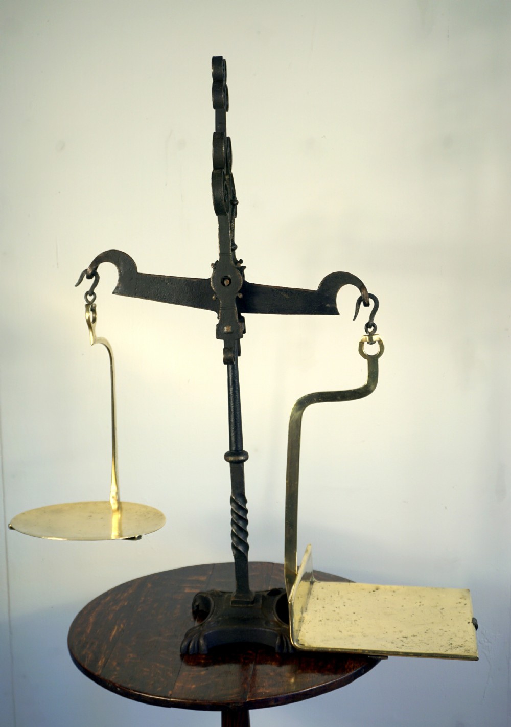 An amazing hand forged wrought iron and brass set of early Victorian scales