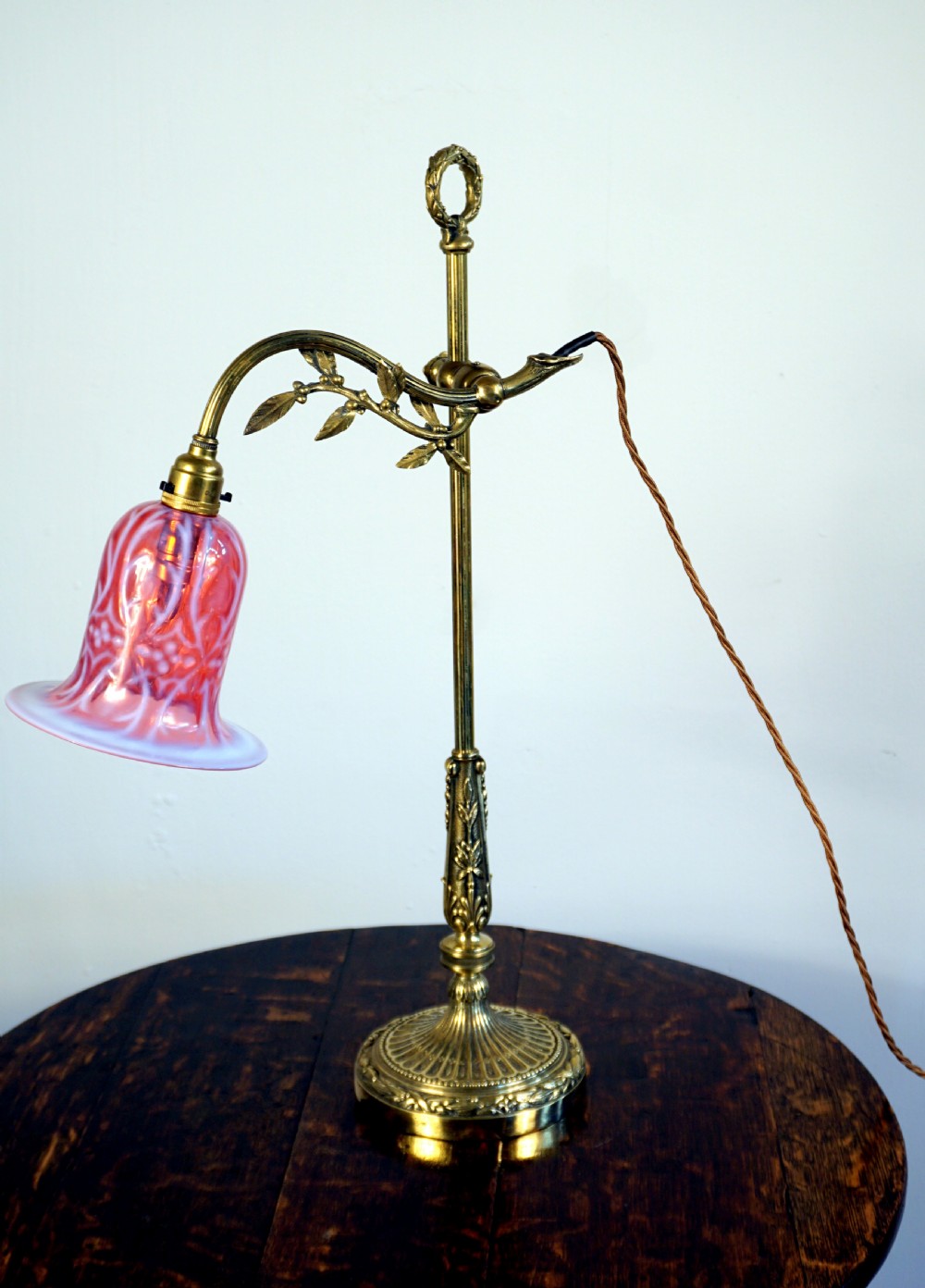 An exceptional early 20th century articulated reading or side lamp