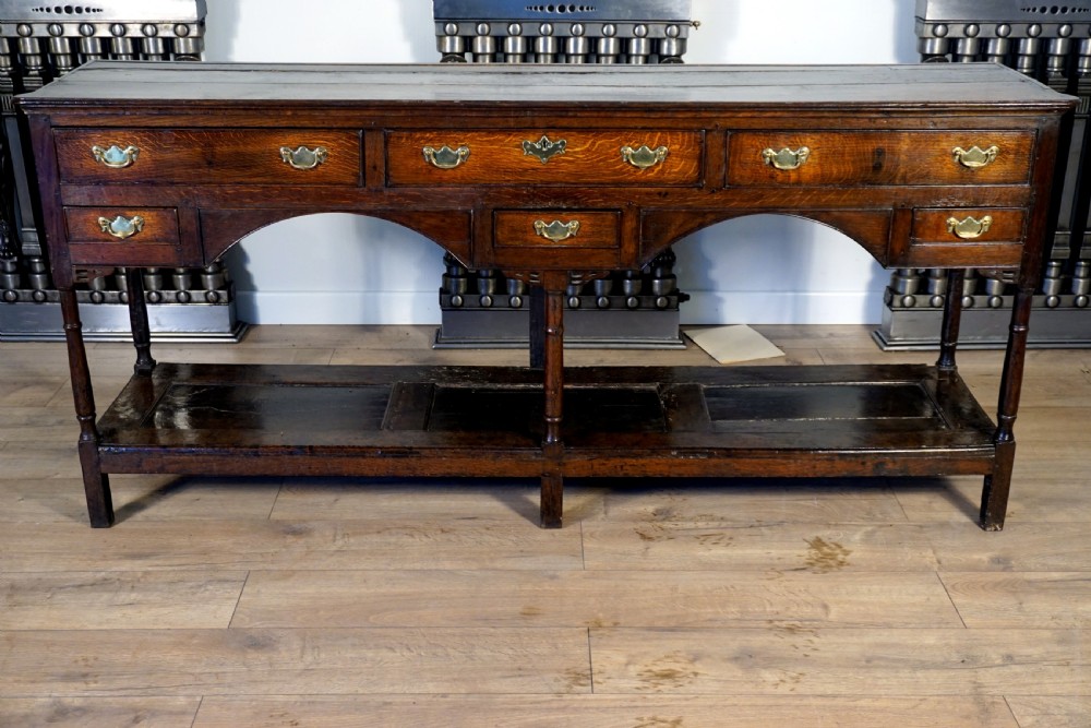 A delightful and unusual well patinated oak Welsh dresser base View II