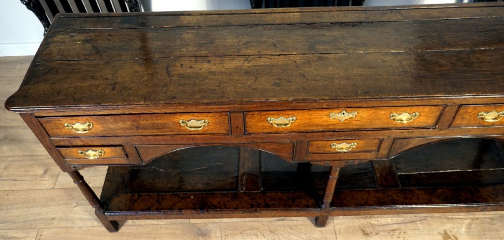 A delightful and unusual well patinated oak Welsh dresser base View IV