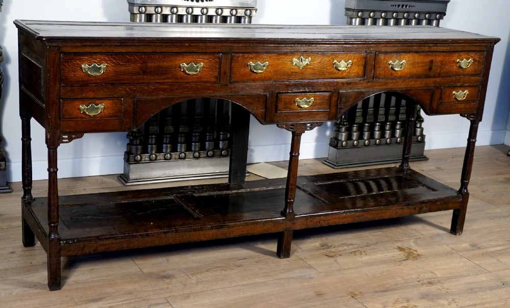 A delightful and unusual well patinated oak Welsh dresser base View IX