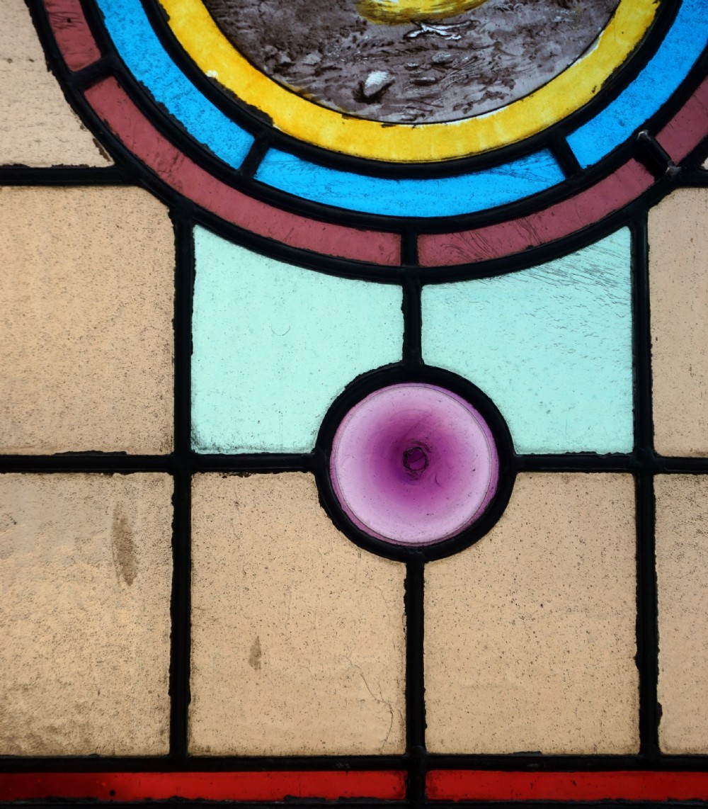 A beautiful stained glass painted bird window View III