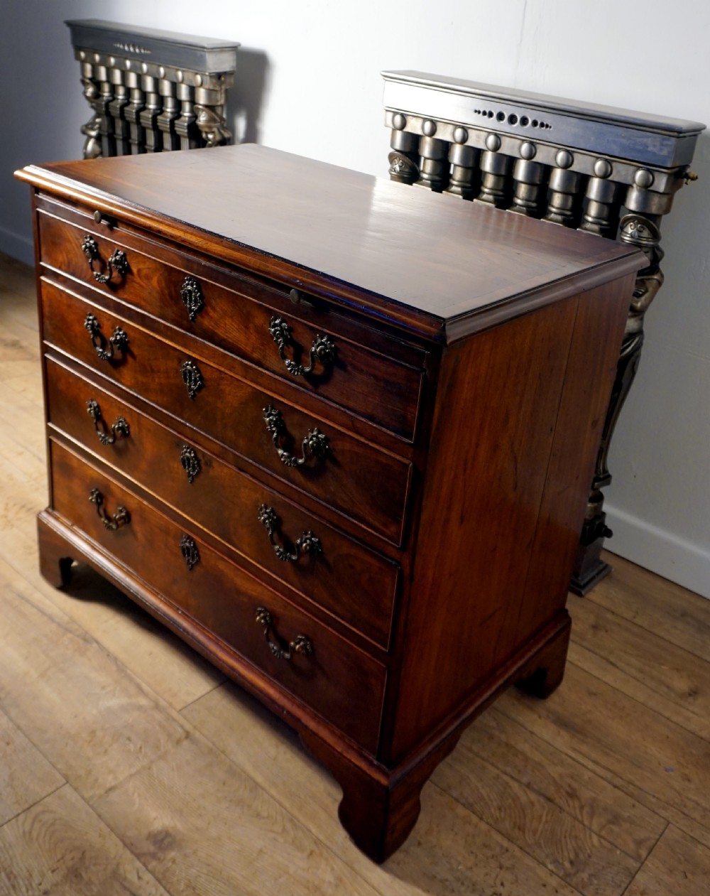 A superb example of a small Georgian chest with brushing slide  View IV