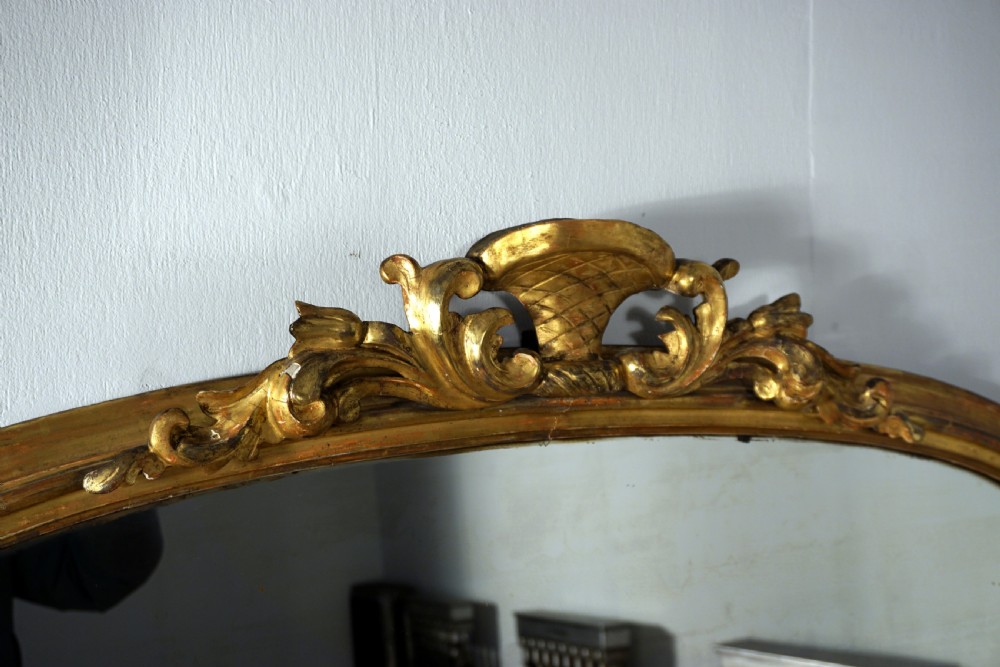 A good carved and gilded regency English overmantle mirror View II