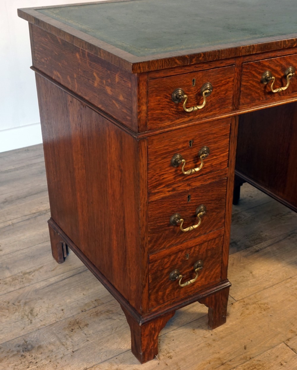 A good original solid oak small size pedastal writing desk View III