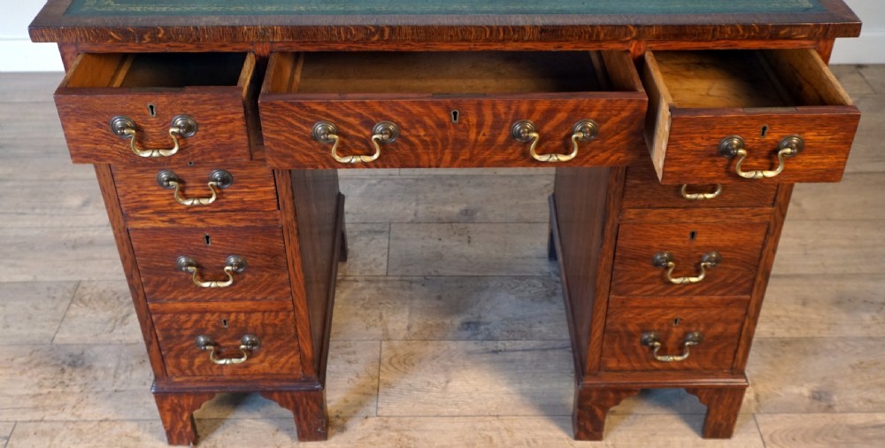 A good original solid oak small size pedastal writing desk View V