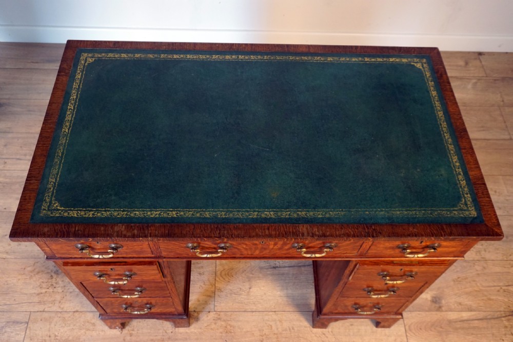 A good original solid oak small size pedastal writing desk View VII