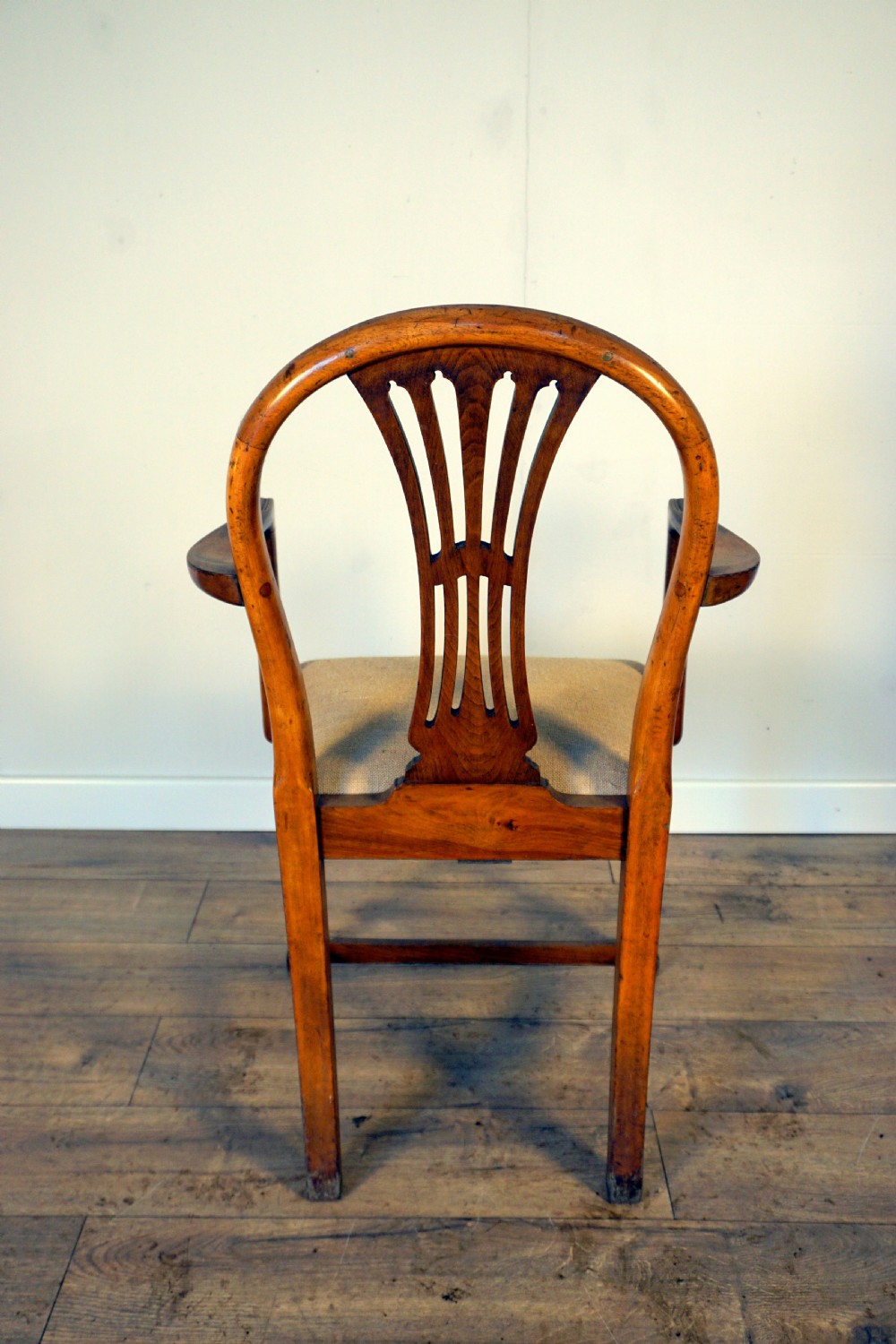A pair of wooden armchairs crafted from birch and elm with slotted back splats and light beige upholstered seats. View IV