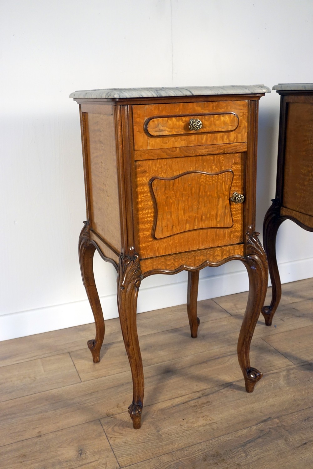 A good pair of French burr Sycamore marble top bedside cabinets  View II