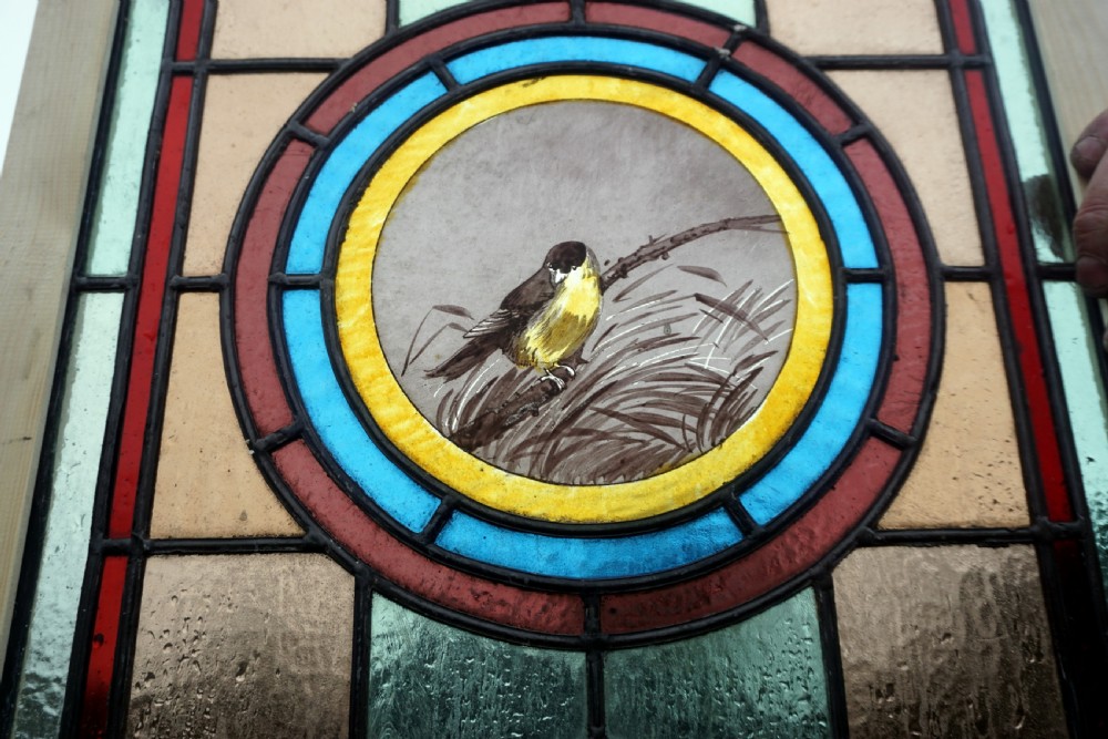 A good stained glass Window With Painted Bird To The Centre View V
