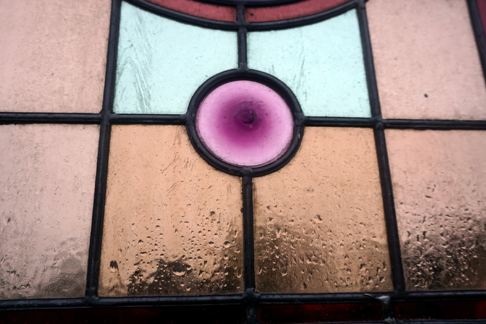 A good stained glass Window With Painted Bird To The Centre View VI