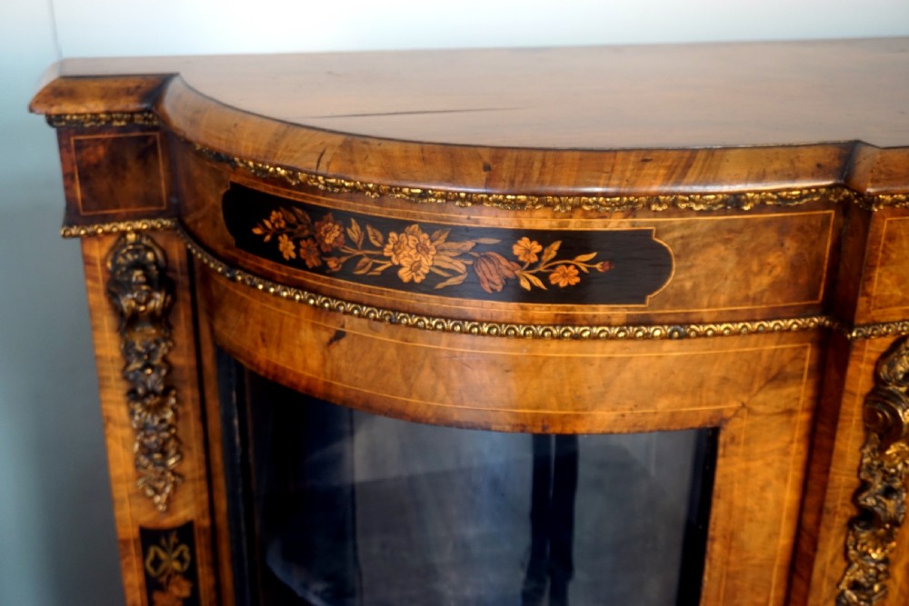 An outstanding matching pair of Victorian burr walnut ormolu and marquetry credenzas View V