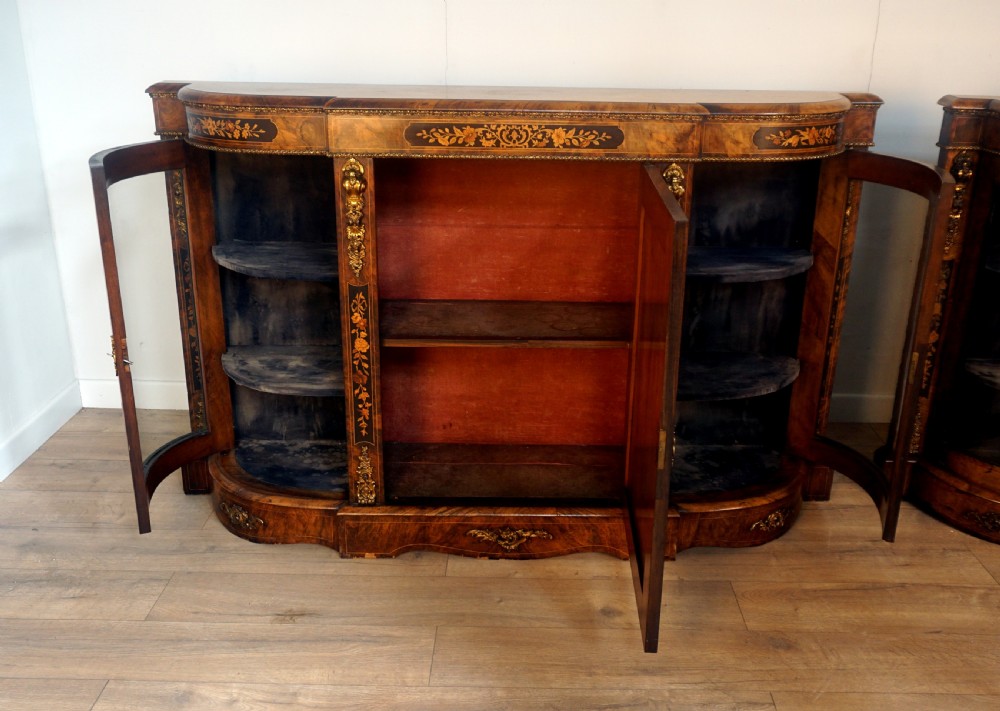 An outstanding matching pair of Victorian burr walnut ormolu and marquetry credenzas View X